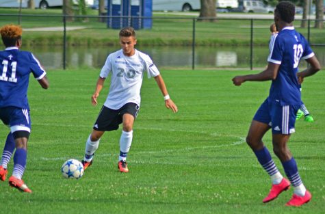 Midfielder Christian Sosnowski passes the ball between St. Ambrose defenders Wednesday at Lakeside Field. The Panthers defeated the Fighting Bees 2-1.