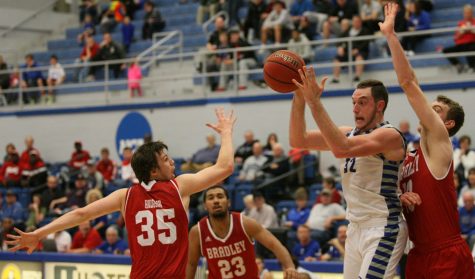 Sophomore forward Patrick Muldoon hauls in one of his two rebounds Tuesday against Bradley at Lantz Arena. The Panthers record moved to 4-3 after the 87-83 loss to the visiting Braves.