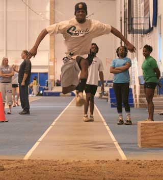 Mens Indoor Track: Jumping his way to success 