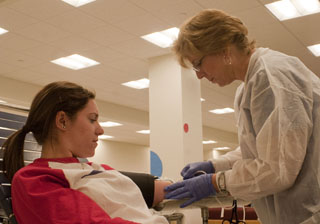 Volunteers donate blood at Bleed Blue Blood Drive 