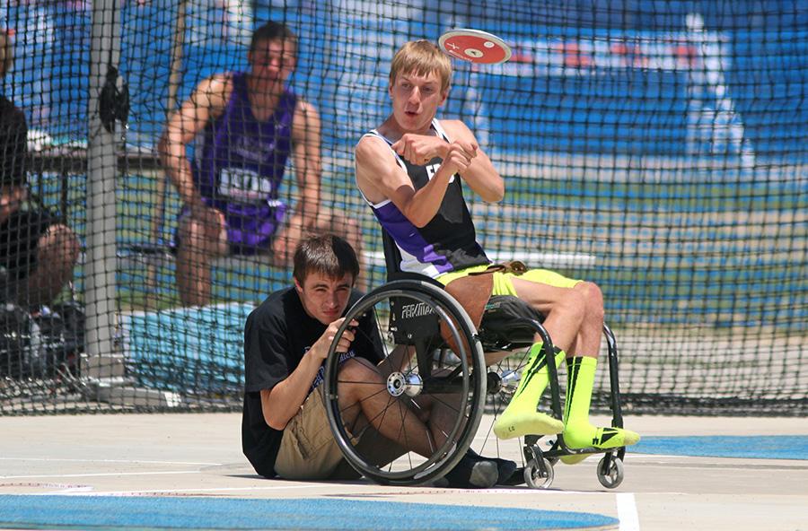 Nathan Schertz, a junior at El Paso-Gridley High School, throws the discus for the discus throw field event during the IHSA Boys State Final Track Meet Saturday at OBrien Stadium. Schertz was the first to compete in the wheelchair division for any race and field event in the final meets history. Schertz threw 12 feet, 6 inches in the discus.