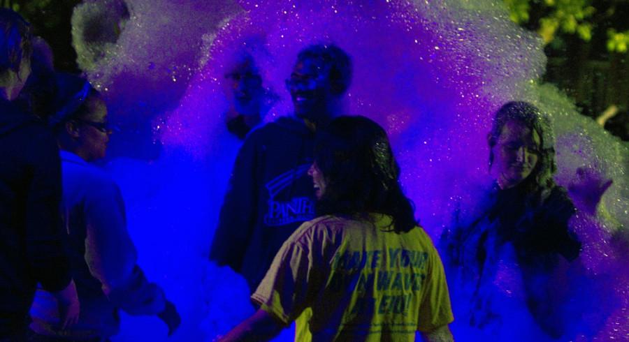 Amanda Wilkinson | The Daily Eastern News 

Students dance in a foam pit Thursday on the campus south quad.