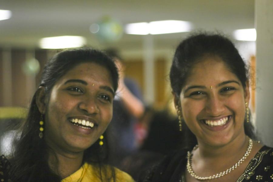 Roberto Hodge | The Daily Eastern News 

Kalpana Pinninty and Anusha Pakalapati, both gradute technology majors from India enjoy a laugh at the Curry House event Thursday.