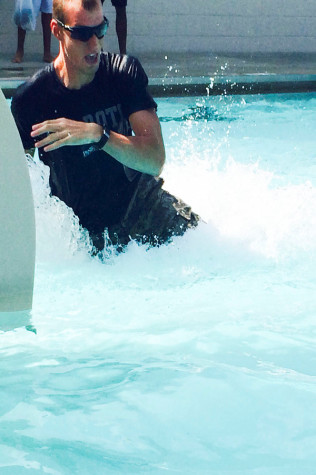 Gerhardt Shafer, a senior engineering major, goes down the slide during their combat water training Wednesday at the Charleston Rotary Community Pool.