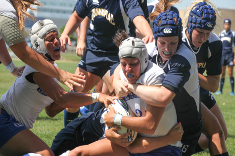 Redshirt sophomore flanker Emalie Thornton is tackled by several players from last year's season open against Quinnpiac on Aug. 31, 2013. The Panthers open their season at 1 p.m. Friday against the Wisconsin All-Stars in Madison, Wis.