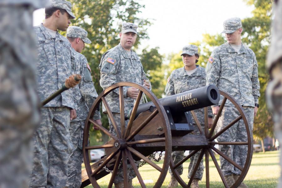 Lt. Colonel Eric Savickas goes through the proper steps on cannon operation as the cadets of Easterns ROTC Panther Battalion become acquainted with it before the first home football game on Saturday at OBrien Field.  Those who man the cannon, the Cannon Crew, fire off the cannon after every touch down made by the Eastern football team.
