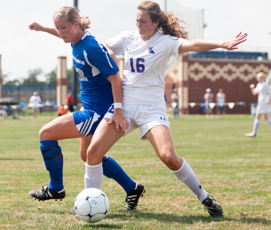 Red-shirt junior forward Chris Reed battles against defender Haley Laque in a game on Sunday at Lakeside Field.  The Panthers lost to the Louisiana Tech Bulldogs 3-1.  The Panthers are 0-4 overall.  Reed was the lone goal scorer for the Panthers.