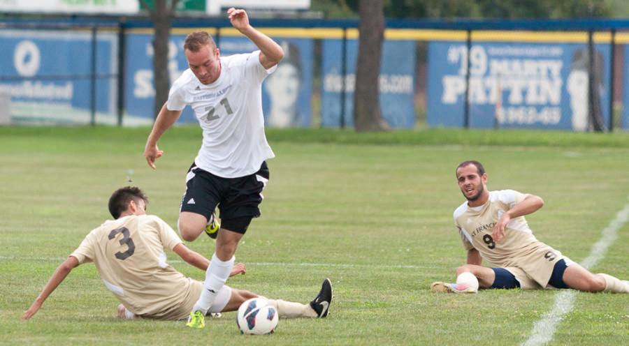 Jason Howell | The Daily Eastern News
Senior Davis Wegmann avoids slide tackles by two St. Francis in a game on Aug. 30 at Lakeside Field.  The Panthers beat the Fighting Saints 2-0.  Wegmann had 3 shots during the game.