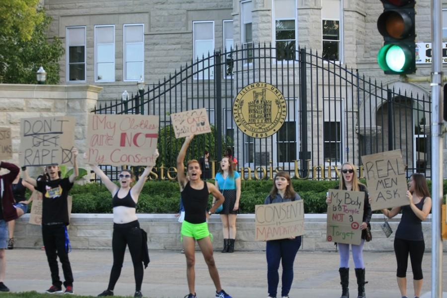 Students shout onto Lincoln Avenue as they participate in the S.L.U.T Walk Tuesday in front of Old Main.