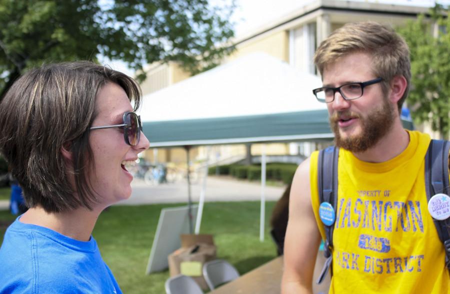 Jenny Greenberg an intern for Girls on the Run informs Ben Misselhorn, senior marketing major about their volunteer services during the fifth annual Volunteer Fair.