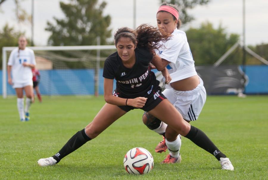 Sophomore forward Gabby Charles fights with senior Frankie Carbajal during a match on Sunday at Lakeside Field.  The Panthers beat the Governors 3-1 to improve to 1-3-0 in the OVC and 2-10-1 overall.