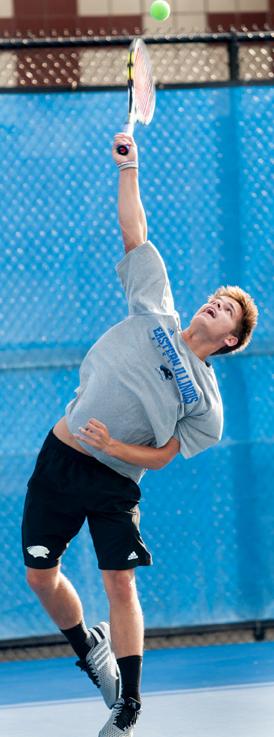 Freshman+Grant+Reiman+serves+the+ball+during+tennis+practice+on+Sept.+30.