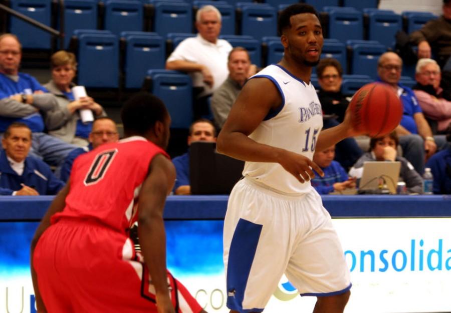 Trae Anderson, a forward, attempts to look for an open man in the game against Ball State University in Lantz Arena.