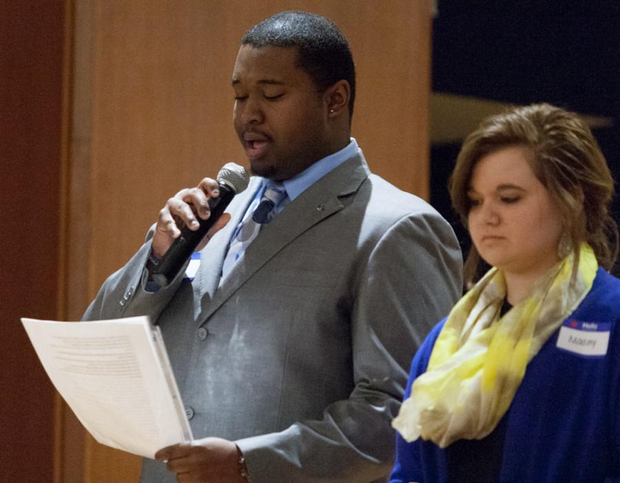 Communication studies major KaSean Carnes reads a poem titled, Unborn Daughter Abigail during EIU Talks: Community. Conflict. Conclusions. on Thursday in the Grand Ballroom of the Martin Luther King Jr. University Union.