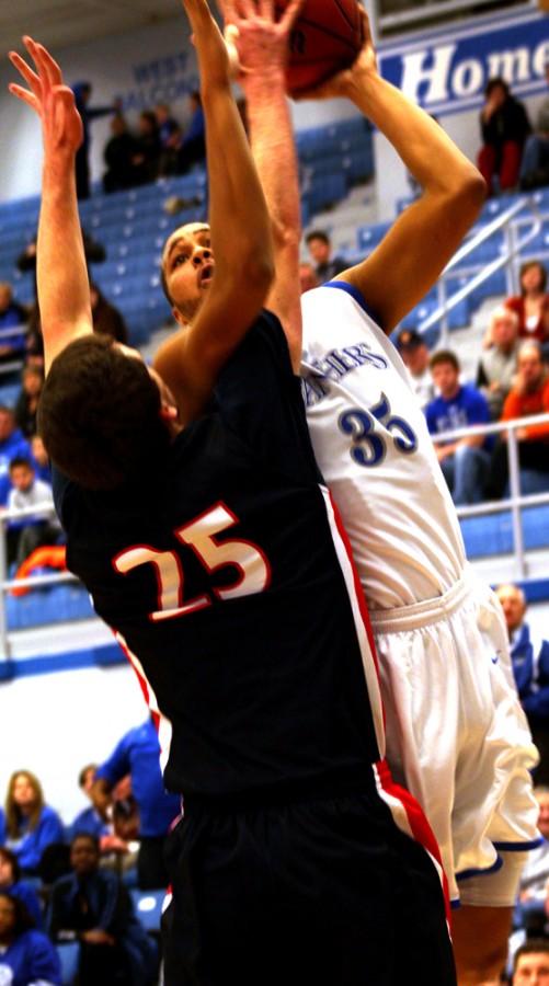 Chris Oliver, a junior forward, attempts a lay-up in the match-up against Belmont Sat. in Lantz Arena. Oliver ended the game with 16 points.