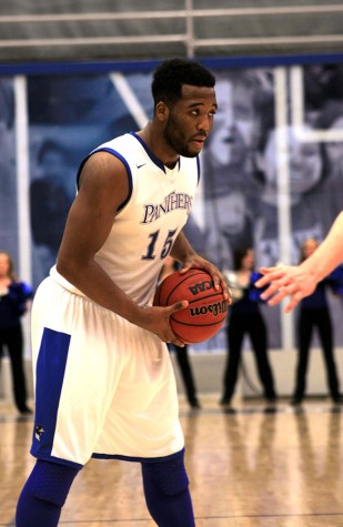 Trae Anderson, a junior forward, looks to pass the ball in the men’s basketball game Tuesday Feb.3 against Baker University. The Panthers beat Baker’s University with the score of 59 to 32.