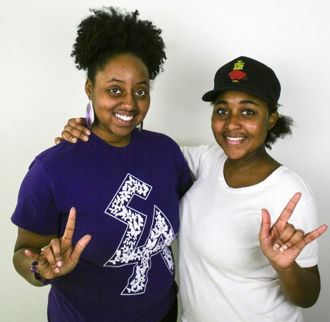 Camille Willims and Tashi Nelson both hold up the symbol representing their sorority. Elogeme Adolphi Christian Sorority, Inc is the only Christian sorority on Eastern’s campus.