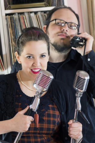 Carrie and Scott Wallace pose with vintage microphones from their collection in their Charleston home, which also doubles as a local studio. 