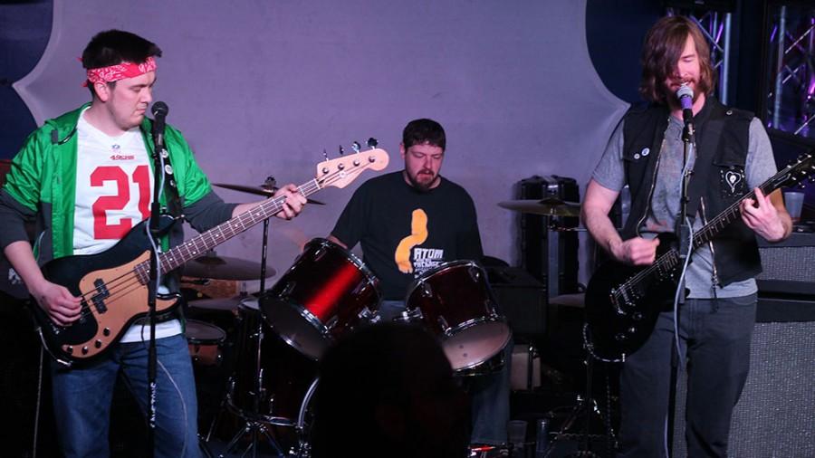 The Band The Tim Blys sings the batman theme  at the Cavetone Records Seven Year Anniversary Spectacular at the Top of the Roc on Saturday.