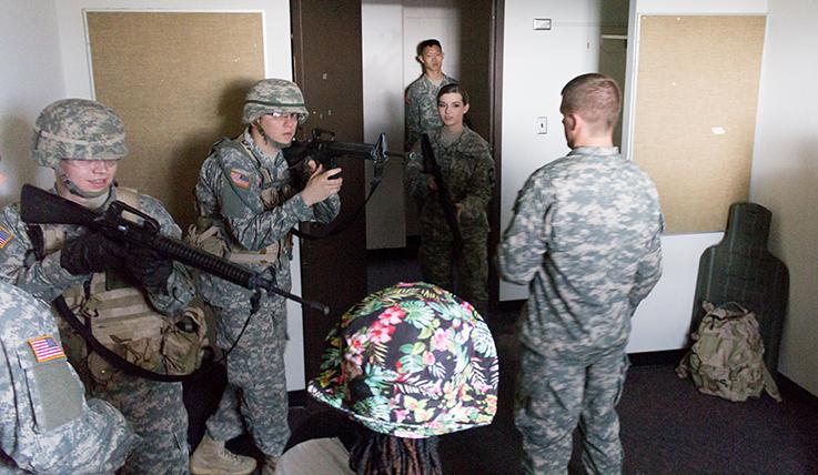 Senior accounting major Matthew Bailey, as squad leader, explains the procedures to clearing rooms to cadets on Thursday in Carmen Hall.