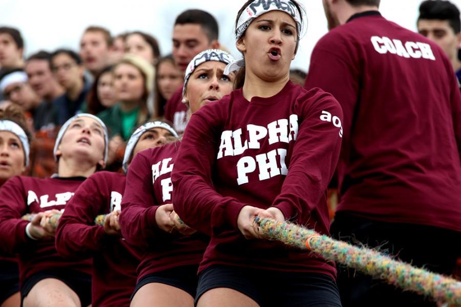 Talia Persico, a sophomore pre business management major, and other members of Alpha Phi compete in the Tugs competition April 6, 2015 at the Campus Pond.