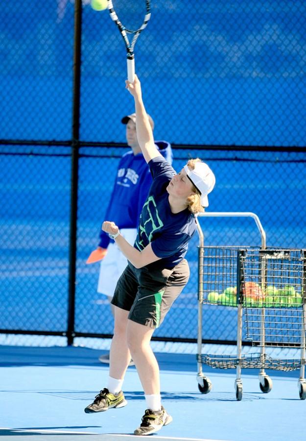 Grace Summers, a freshmen, practices a serve at the Darlings Courts Tues. March 31 during the Panthers tennis practice.