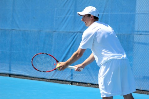Junior Rui Silva prepares to serve the ball during the Eastern Men’s tennis match Saturday at Darling Courts. 