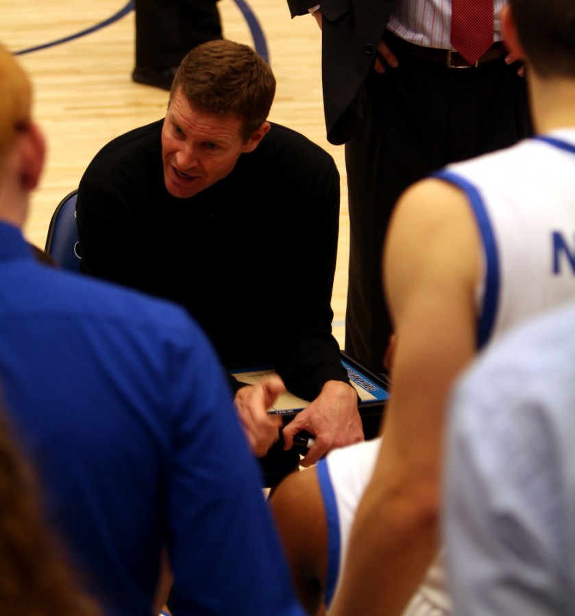 Head coach, Jay Spoonhour, goes over a game plan with his team in one of the regular season games in Lantz Arena. Spoonhour and the Panthers ended the season with a 18-15 record.