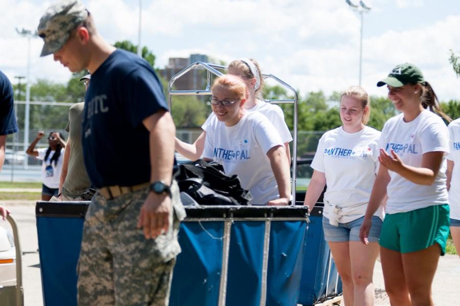 Prowl staff members as well as members of Easterns ROTC help move in students to Thomas Hall on Thursday.
