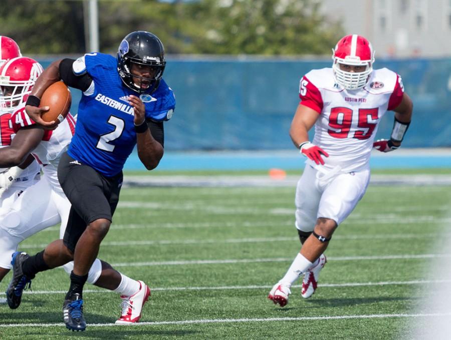 Junior quarterback Jalen Whitlow runs with the ball down field against Austin Peay on Sept. 2, 2014 at OBrien Field. Whitlow set an Eastern record, with 137 rushing yards by a quarterback, as the Panthers won 63-7.