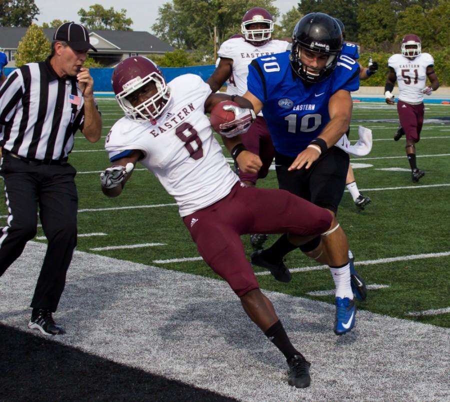 Eastern Kentucky defensive back Johnny Joseph is shoved out of bounds by former Eastern quarterback Jimmy Garoppolo in a game on Sept. 28, 2013 at OBrien Field.