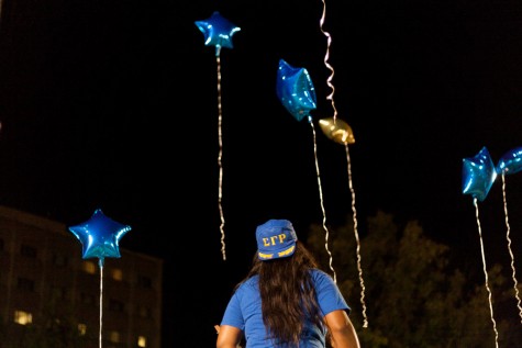 Members of Sigma Gamma Rho release balloons to honor the memories of Sandra Bland and others who have lost their lives to social injustice during First Night on Sunday on the South Quad.