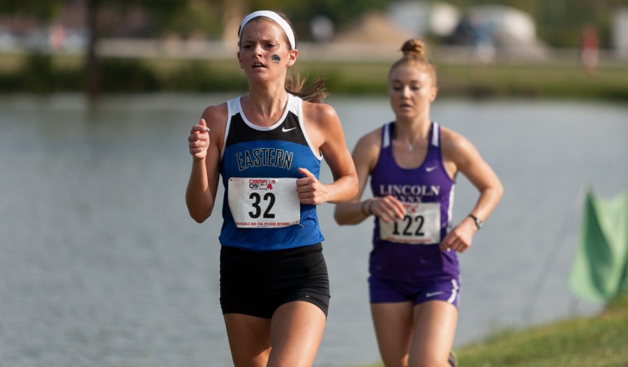 Kristen Rohrer runs ahead of Mallory Tharp of Lincoln College in the womens portion of the Walt Crawford Invitational on Friday on the Panther Trail.