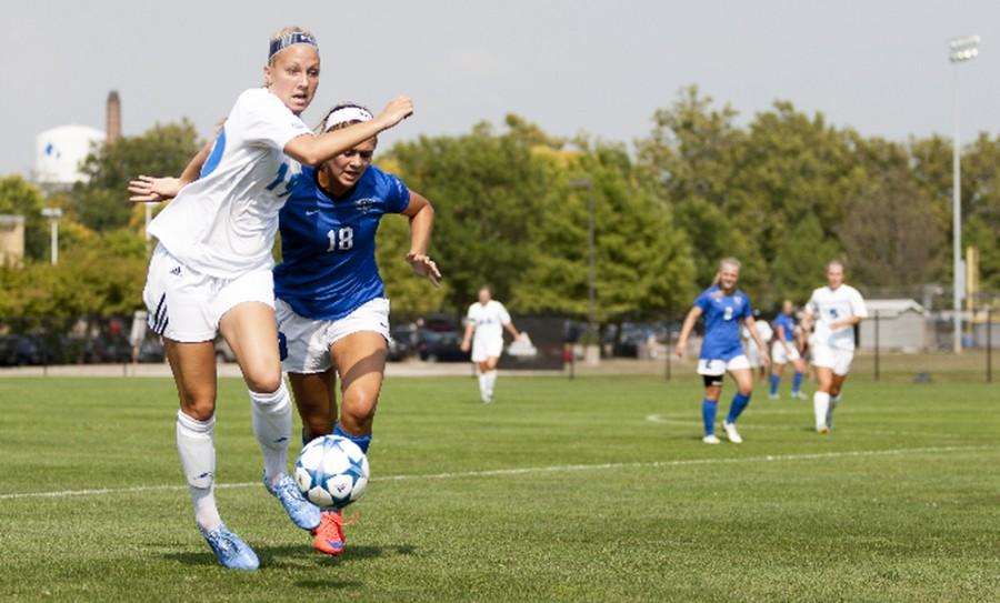 Freshman Kate Olson runs alongside IPFWs Paityn Fleming during the Panthers 3-1 victory on Sept. 4 at Lakeside Field.