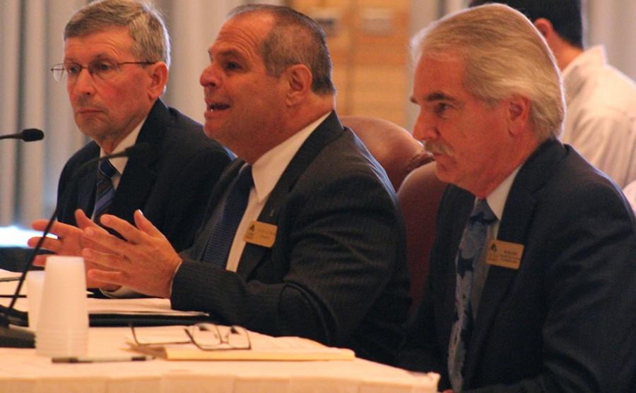 President David Glassman, (center) along with Blair Lord (right) and Paul McCann (left) speaks with the State Senate Higher Education Committee on Monday about the university budget in the Grand Ballroom of the Martin Luther King, Jr University Union.