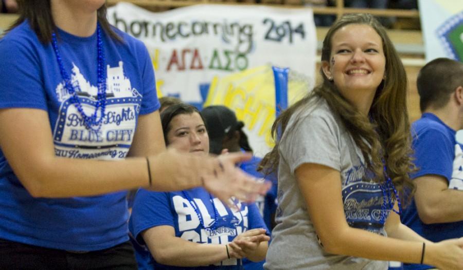 Amie Hansen, creator and president of the EIU Blue Crew, claps along with other students and staff during Yell Like Hell on Oct. 24, 2014 in the McAffee Gym.