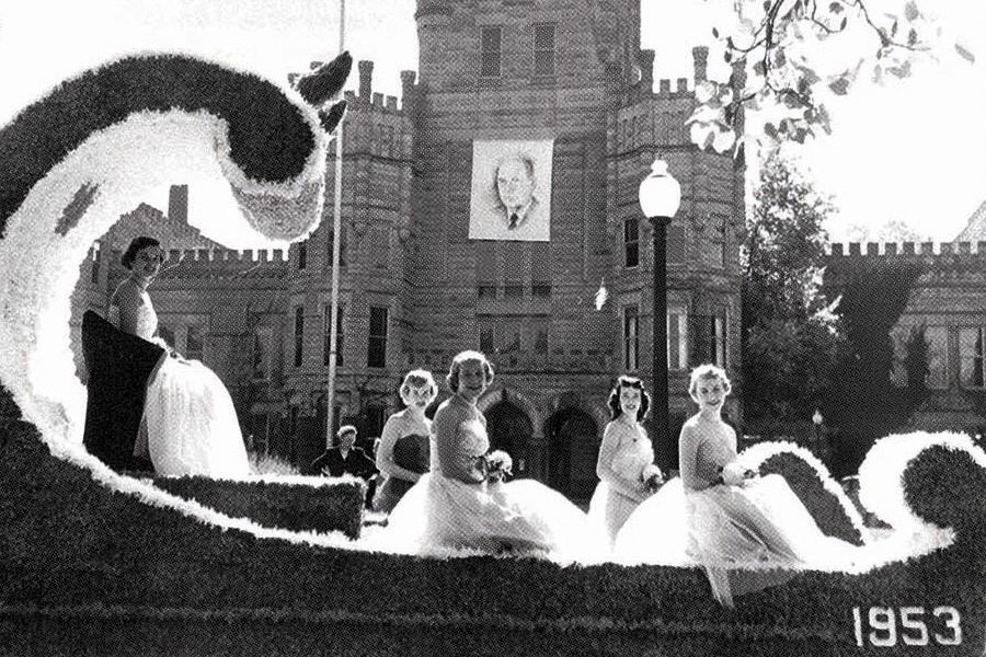 The 1953 homecoming court rides through the streets of Charleston during the Homecoming Parade.