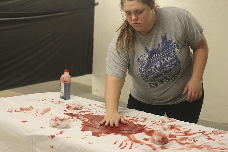 Candice Basista, a sophomore pre-nursing major, prepares for Pemberton’s “Haunted Hospital” on Wednesday in the basement of Pemberton Hall. Basista said this hauted house brings not just Pemberton’s residents together, but the entire campus for scary fun. The haunted house is $2 for entry.