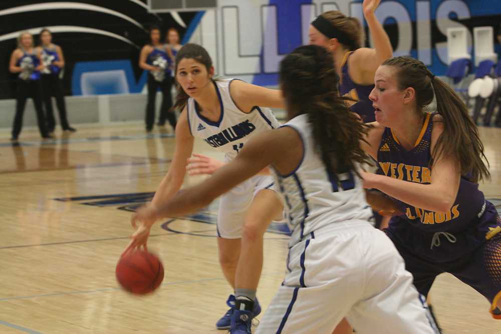 Junior forward Erica Brown prepares to pass the ball during  the Eastern Women’s Basketball game against Western Illinois University on Dec. 2 in Lantz Arena.