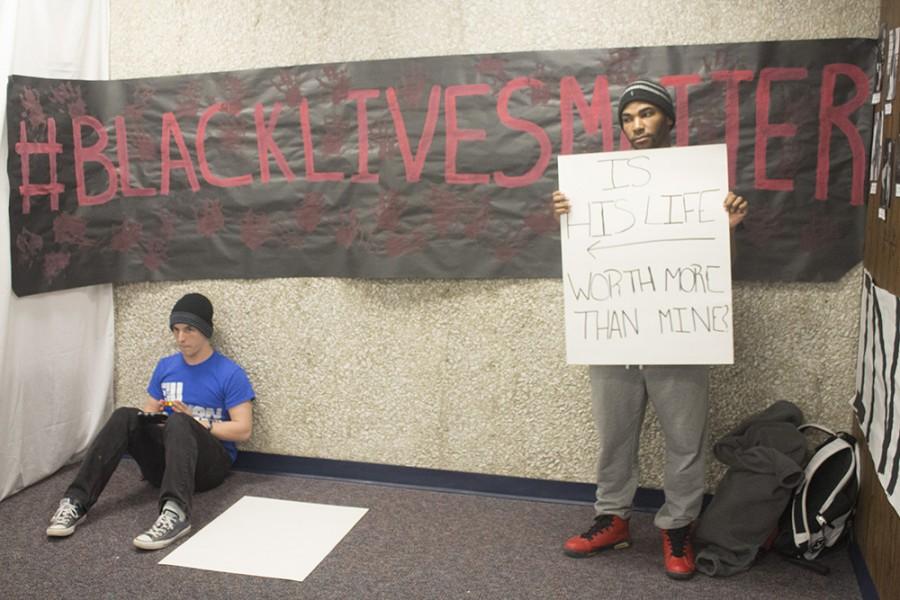 Gavin Peterson, a freshman applied engineering and technology major, and Nathan Barnett-Bishop, a sophomore engineering participates in the police brutality segment of the Tunnel of Oppression on Tuesday in the basement of Stevenson Hall