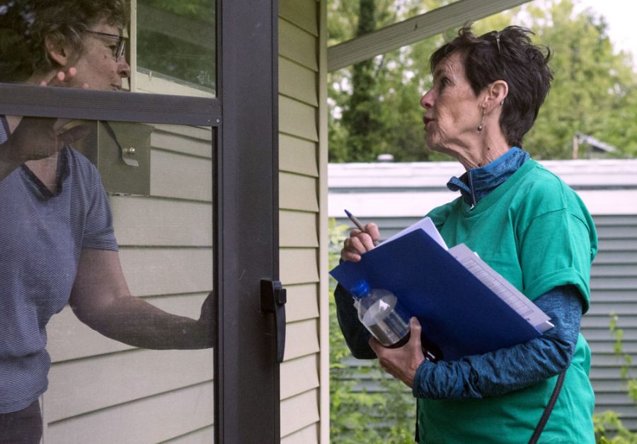 Deborah Lynch, an associate professor at Chicago State University, canvasses after the demonstration and march on May 16. Lynch and her peers visited the houses of registered voters in the area to ask them to sign a petition and/or put a sign in their yard.