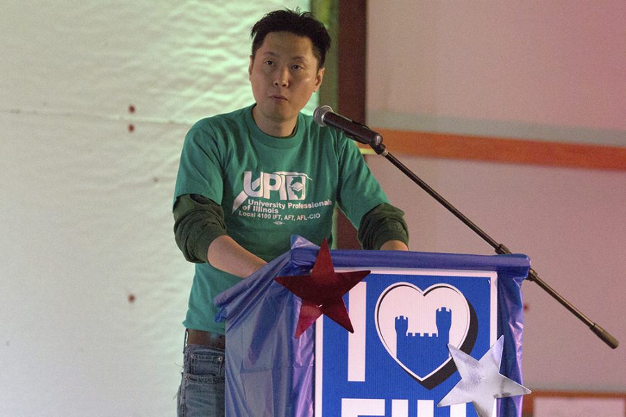 Billy Hung, media coordinator for Easterns chapter of the University Professionals of Illinois, speaks to the crowd at FundFest on Saturday at the Coles County Fairgrounds.
