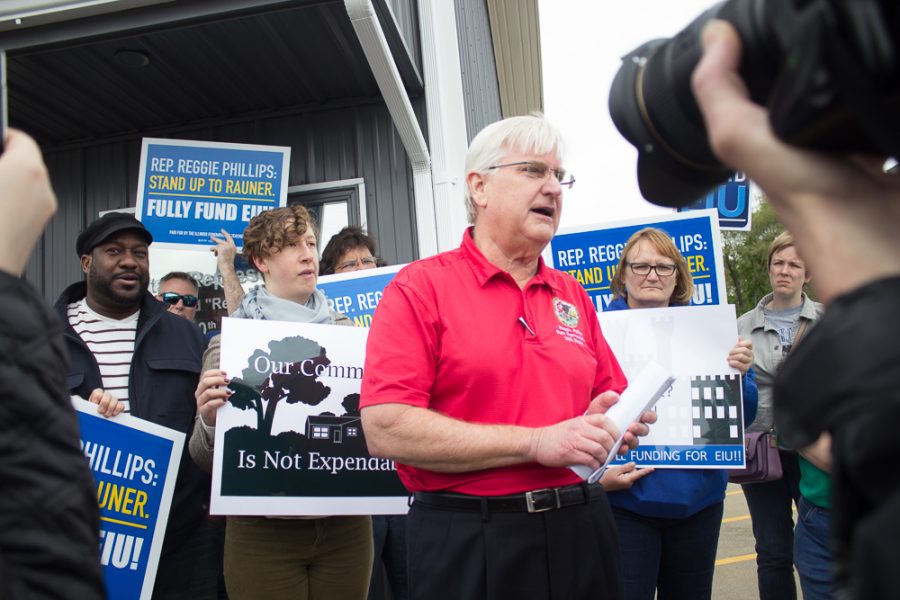 Members of Easterns chapter of the University Professionals of Illinois stand outside the office of Rep. Reggie Phillips on May 16.