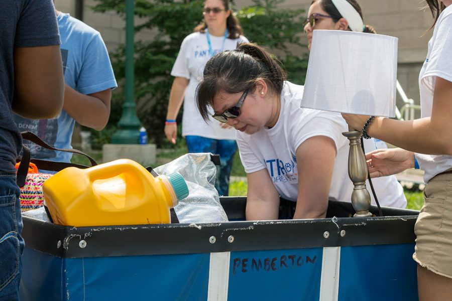 Carol Wong, a graduate student in dietetics, loads a move-in cart at Pemberton Hall Thursday. Wong, as well as several others, volunteered to help students move.