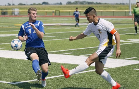 Sophomore midfielder Brendan McDonough attempts to block a pass during Sunday’s 1-2 loss to Milwaukee at Judah Christian High School in Champaign.