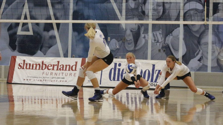 Lindsey Powers returns a serve while teammate Josie Winner backs her up in a 3-2 loss to Butler on Tuesday at Lantz Arena.