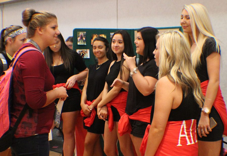Members of Alpha Gamma Delta talk to students about their sorority during Pantherpalooza in the Grand Ballroom of the Martin Luther King Jr. University Union Wednesday.