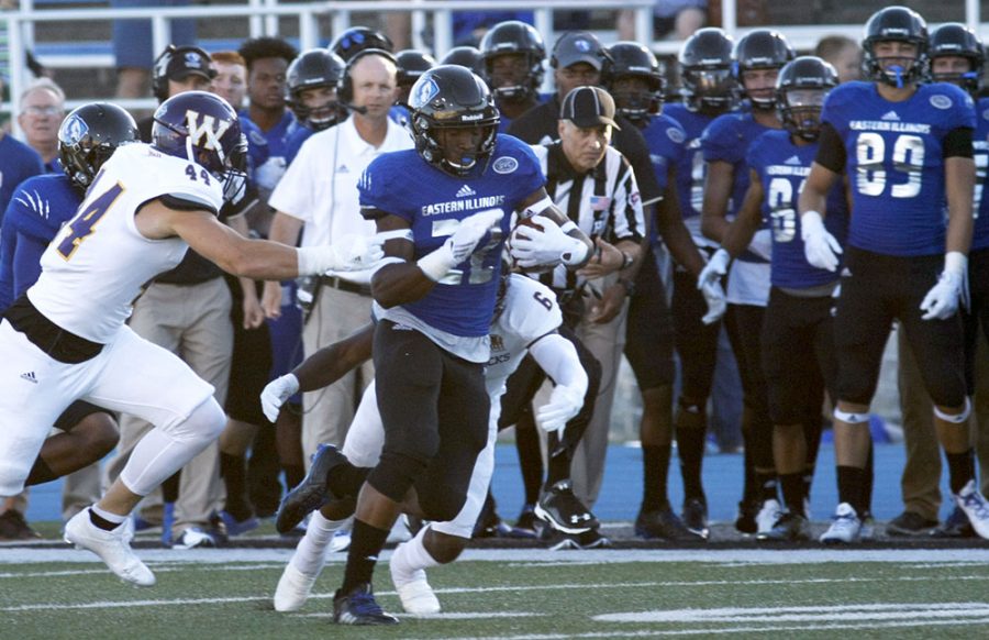 Eastern runningback Korliss Marshall breaks away from Western defenders in the first half Thursday at OBrien Field. The Panthers lost 38-21.