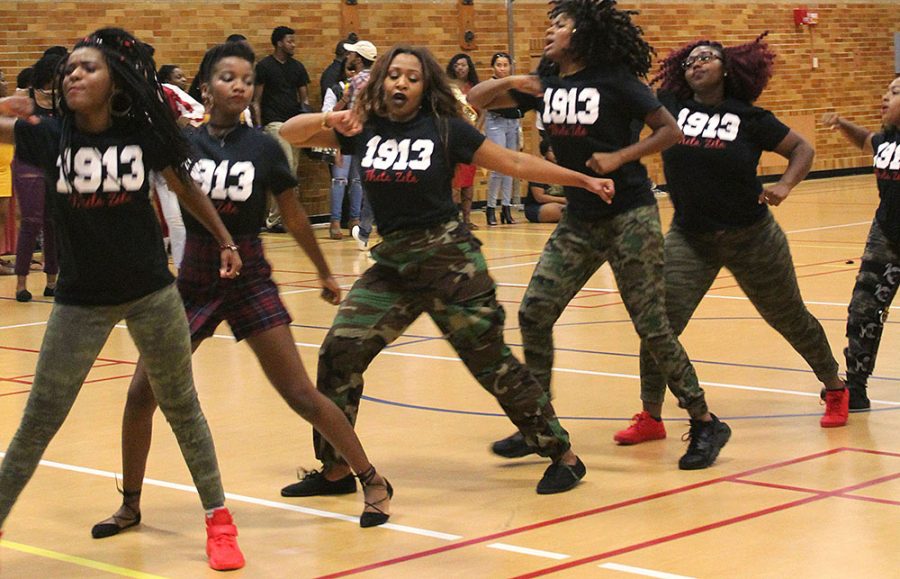 Gabby Bersamin | The Daily Eastern News A group of Delta Sigma Thetas stroll during Meet the Greeks Friday in McAfee Gym.