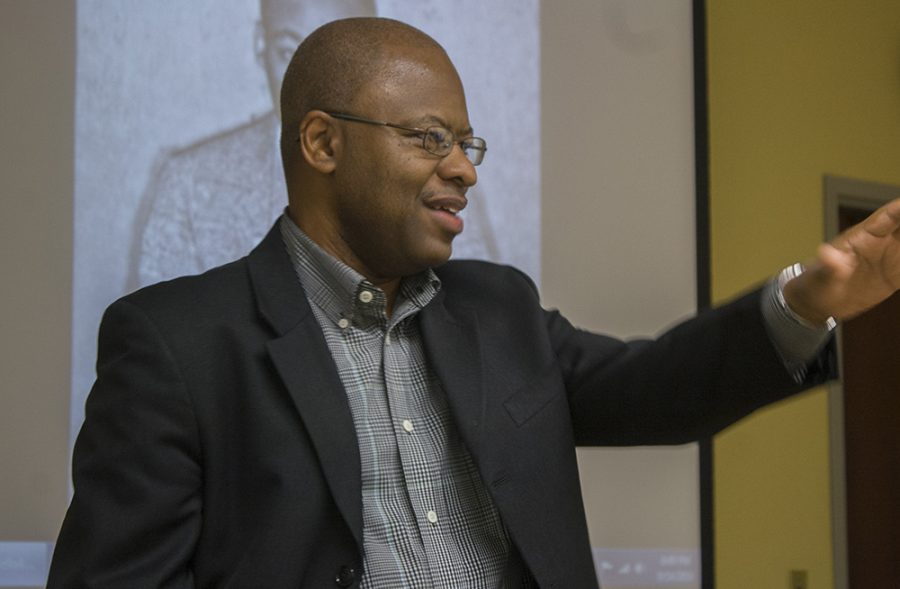 Cassie Buchman | The Daily Eastern News Political science professsor Kevin Anderson talks about the power of images, especially as they pertain to African-American politics and movements, at the Booth Library Wednesday.